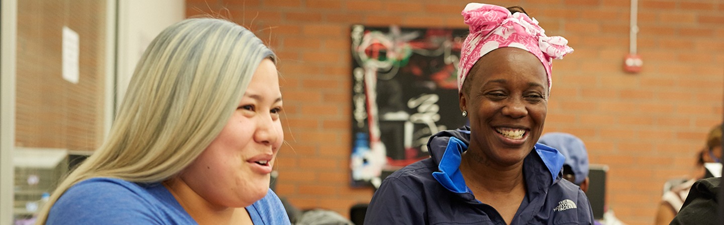 2 students laughing