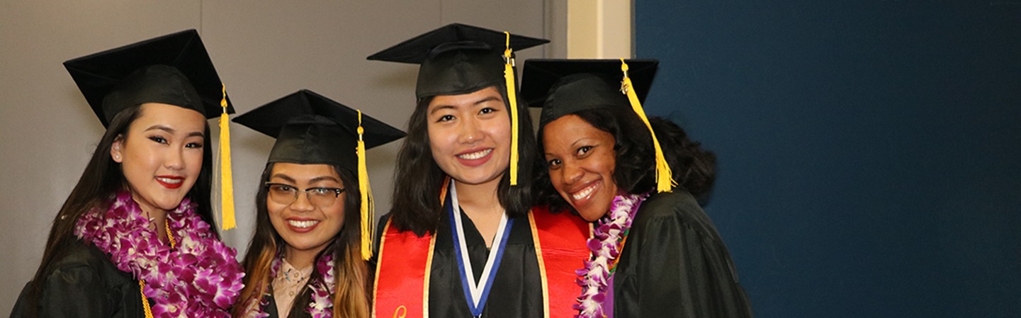 CCC women in graduation gowns