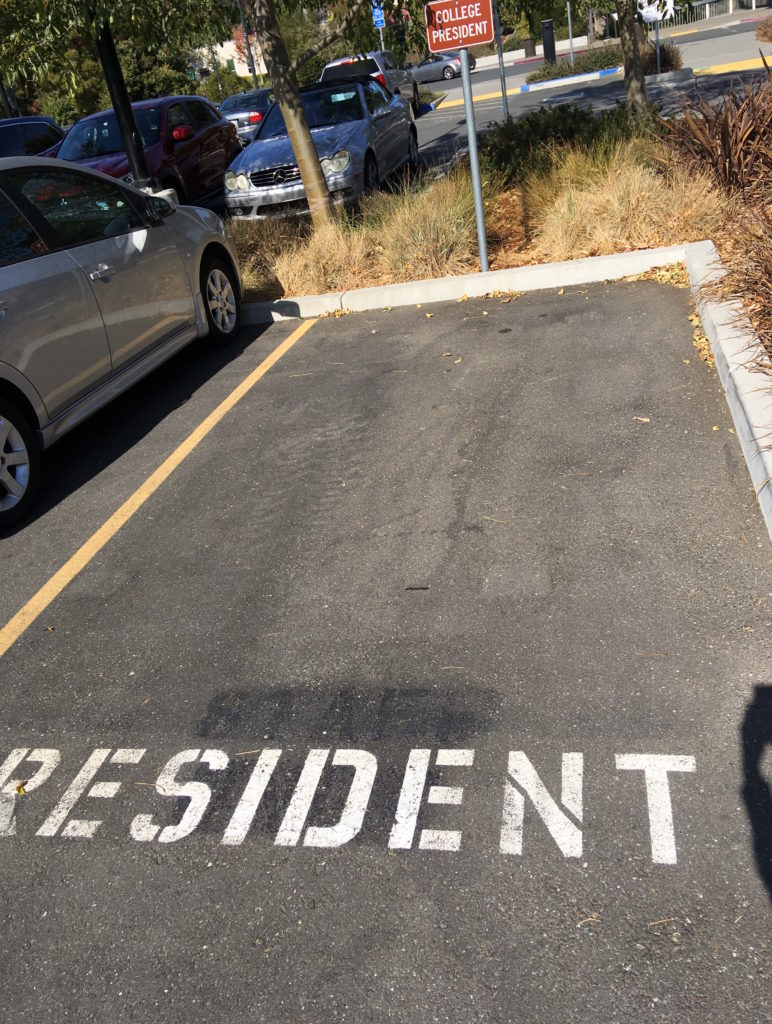 Picture of presidents parking spot with no car in it.