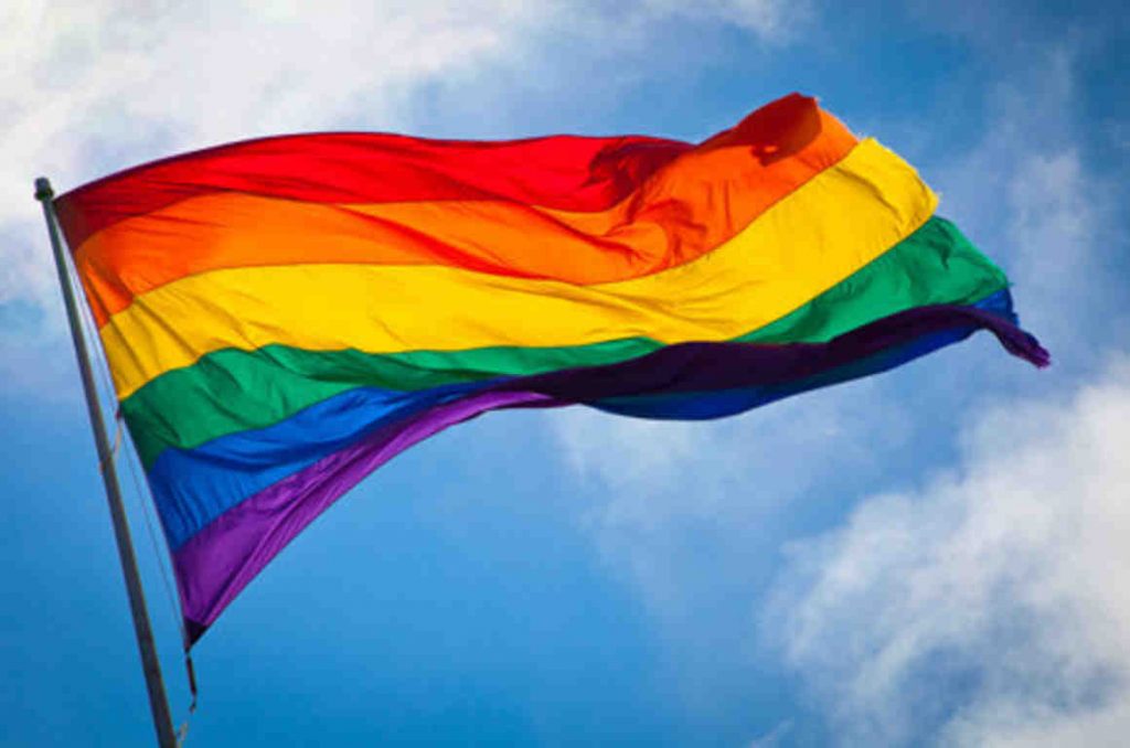 Pride flag against sky