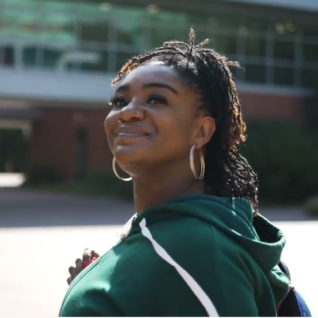 Student on campus smiling