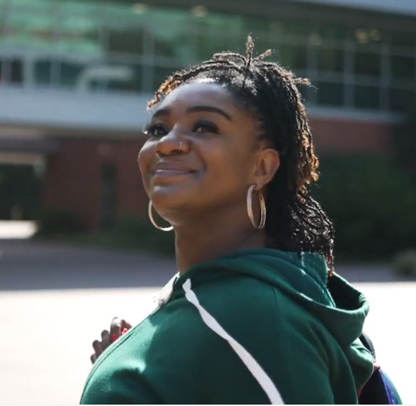 Student on campus smiling