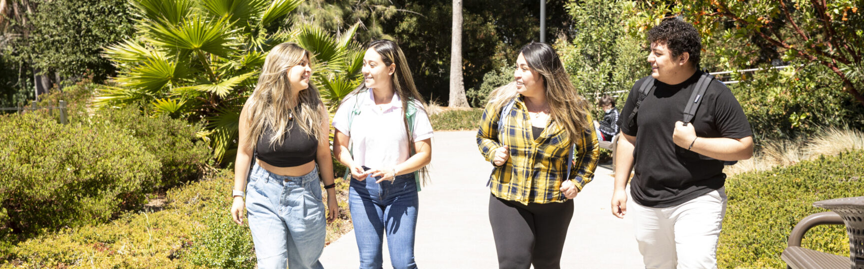 four students walking