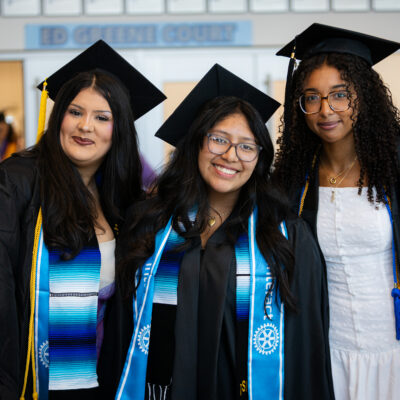 Three student graduates 2026 graduation